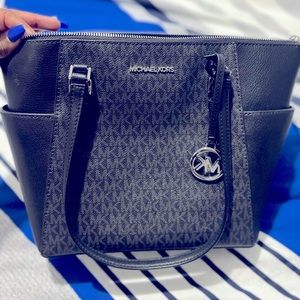 Black and gray Michael Kors Purse.